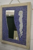 A decorative tiled mirror.