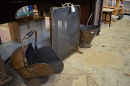 A brass folding spark guard and two coal scuttles.