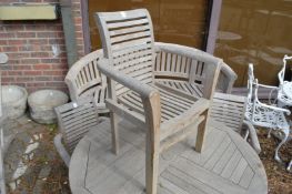 A set of four children's teak garden armchairs.