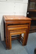 A nest of three Chinese tables.
