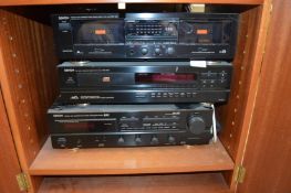 A hi-fi cabinet containing Denon hi-fi together with a pair of Mordaunt-Short speakers.