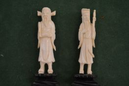 Two carved Chinese figures.
