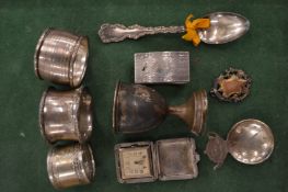 Silver napkin rings and other items.