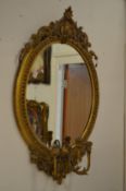 A good 19th century gilt framed oval girandole mirror.