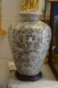 A large pair of Chinese style urn shaped pottery table lamps.