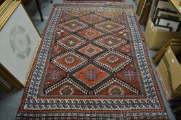 A Persian rug with geometric decoration.