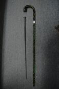 Two glass walking sticks.