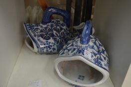 A pair of Chinese blue and white fish shaped dishes or vases.