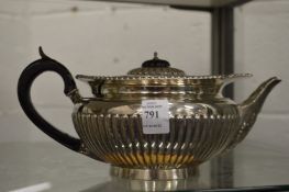 A silver teapot.