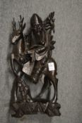 A Chinese carved wood and silver wire inlaid model of a priest on a deer.