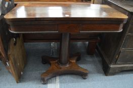 A 19th century rosewood foldover card table.