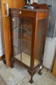 A mahogany display cabinet.