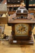 A walnut mantle clock (AF).