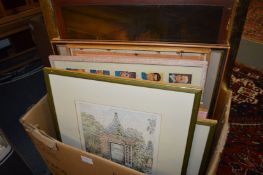 A box of paintings and prints.