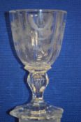 An engraved glass goblet (small rim chip).