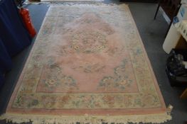 A Chinese pink ground carpet.