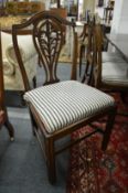 A set of six George III design mahogany dining chairs.