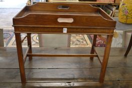 A mahogany rectangular tray table.