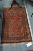 A small Bokhara prayer rug.