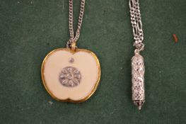 Two decorative pendants.