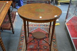 An Edwardian inlaid and painted mahogany oval occasional table.