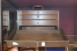 A wooden mechanic's tool chest.