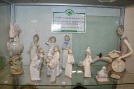 A Royal Dux cockatoo, Lladro figures and similar items.