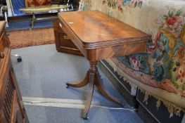 A Regency style mahogany pedestal foldover card table.