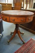 A 19th century mahogany drum table (AF).