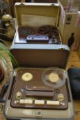 Two old reel to reel tape players.