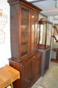 A Victorian mahogany cupboard bookcase.