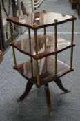 A small revolving tabletop bookcase.