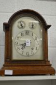 A good oak cased mantle clock.
