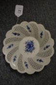 A pierced porcelain bowl.