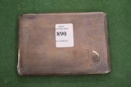 A silver cigarette case.