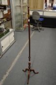 A mahogany pole screen stand.