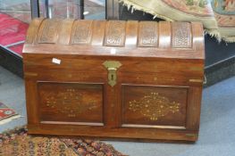 A good eastern carved hardwood and brass inlaid dome topped trunk.