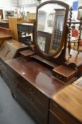 An Edwardian inlaid mahogany dressing chest.