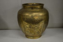 A Chinese engraved brass jar.
