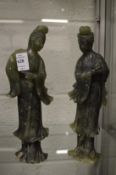 A pair of Chinese carved jadeite figurines.