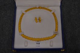 A heavy yellow metal necklace with matching earrings, both stamped 999. 110 grams