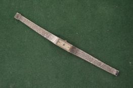 A ladies' Bueche-Girod dress watch in original box, the watch stamped 9ct. Gross weight 25 grams