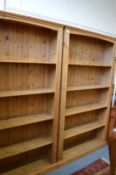 A pair of pine standing open bookcases.