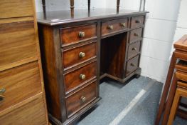 A mahogany kneehole pedestal desk.