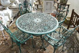 A green painted aluminium circular garden table with four armchairs.