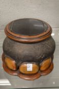 An early 20th century elephant foot mounted box with bi-fold hinged lid.