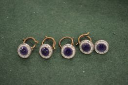 Five silver and enamel studs.