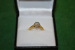 A good golden diamond solitaire ring.