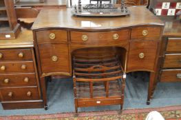 A mahogany serpentine fronted sideboard.