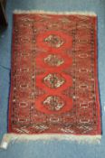 A small Bokhara rug.